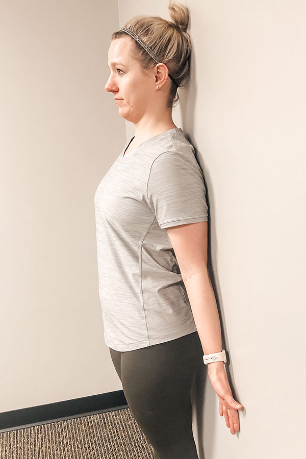 Standing wall posture outlet exercise